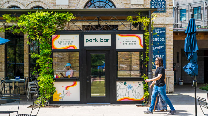 Couple walking toward Park Bar