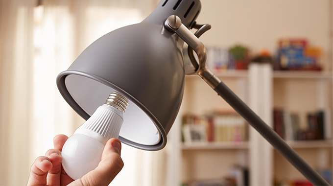Changing the lightbulb in a lamp