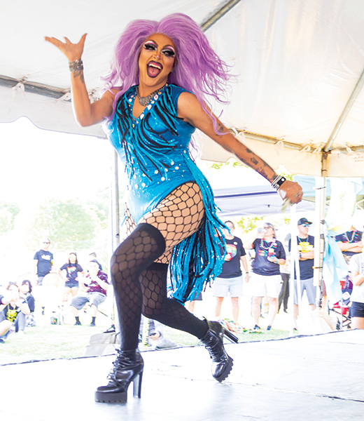 A local performer dances at The Curse’s tailgate drag show.