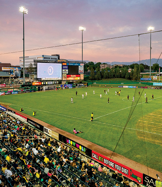 Players on the soccer pitch at Isotopes Park