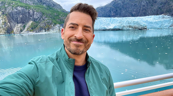 Doug Shupe taking a selfie in front of a glacier