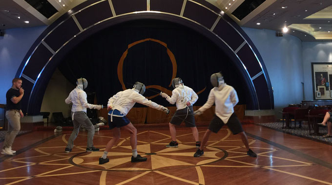 A group of people fencing