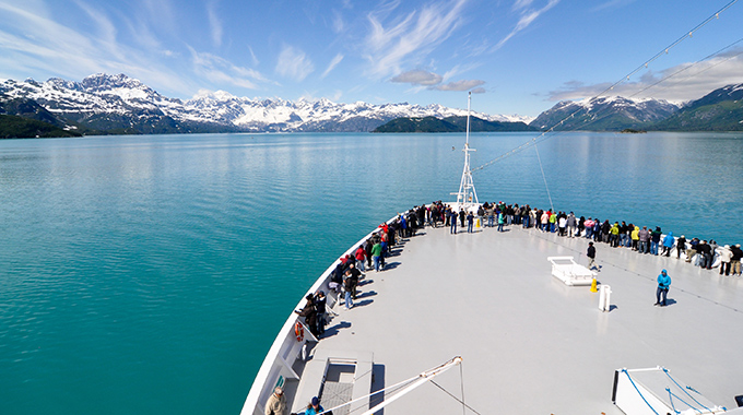 Cruisers lining the deck of a Holland America cruise ship