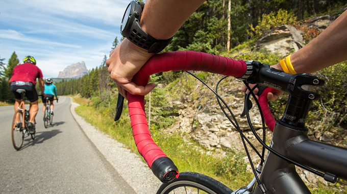 Cyclists cruise Bow Valley Parkway, the scenic route between Banff and the Lake Louise area. Banff and Lake Louise Tourism / Paul Zizka Photography