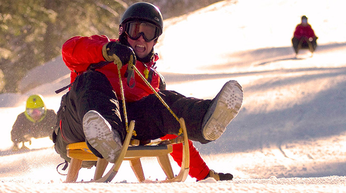 Sledding on the 4.7-mile piste de luge in Charlevoix, Quebec, Canada