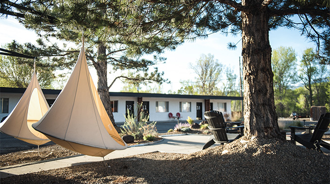 A favorite spot to take in the mountain air that surrounds Amigo Motor Lodge: the “cocoon chairs” that hang out front (rivaled only by the fire pit-adjacent cocoon chairs).  | Photo by Anthony Barlich, courtesy Amigo Motor Lodge