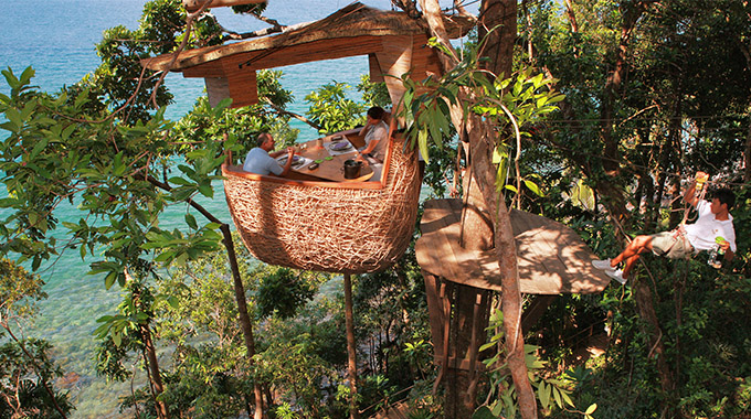 Why yes, that is a zip-lining waiter. And if you book his services at Soneva Kiri, he’ll deliver locally sourced delicacies to your bamboo tree pod in an ancient, seaside rain forest. | Photo courtesy Soneva Kiri