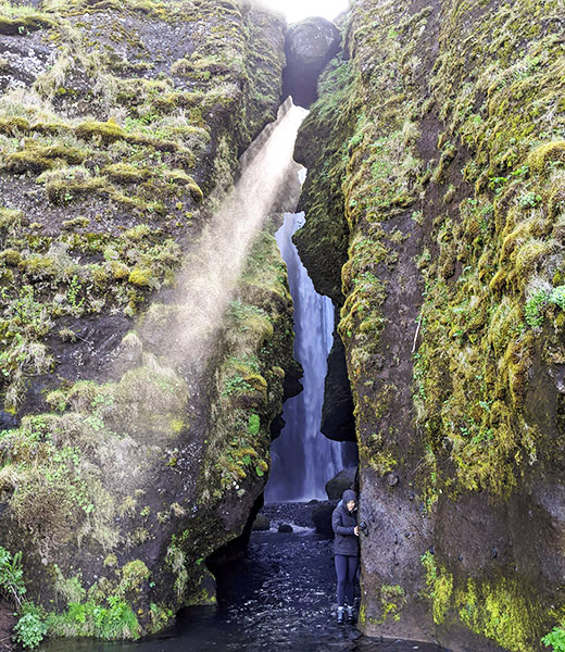 A narrow, moss-covered slot canyon near Seljalandsfoss. | Photo by Jessica Fender