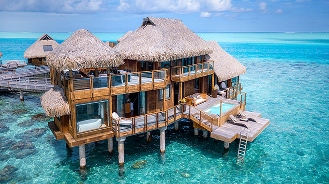 With two stories, multiple terraces, and a private pool (just for starters), this Presidential Villa redefines the overwater bungalow. | Photo by Adam Bruzzone/Courtesy Conrad Hotels and Resorts