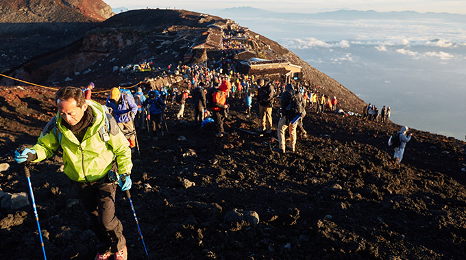 Hikers continue on the path to reach the lip of Mount Fuji's volcanic crater. | Photo by Rob Andrew