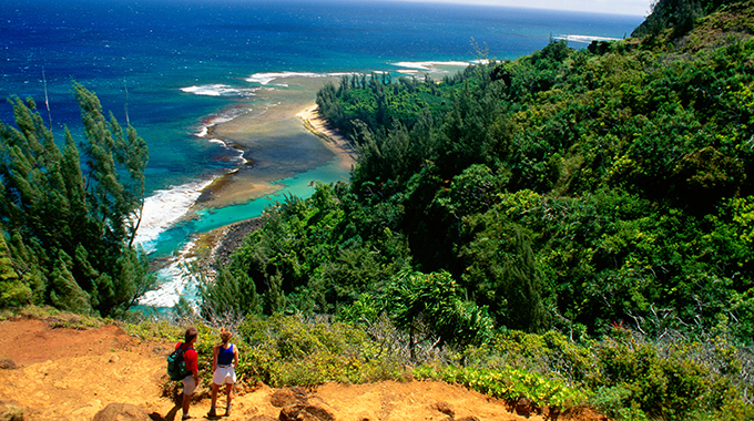 A couple hike the trail above Ke'e Beach. |  Photo by Design Pics Inc./Alamy Stock Photo