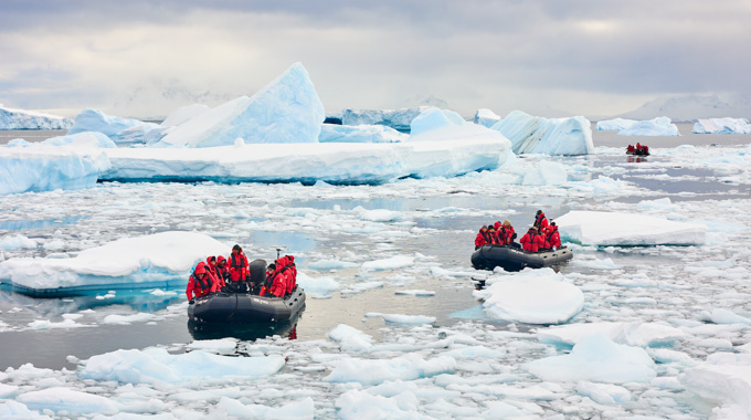 Viking Expedition guests exploring icy waters aboard small boats.