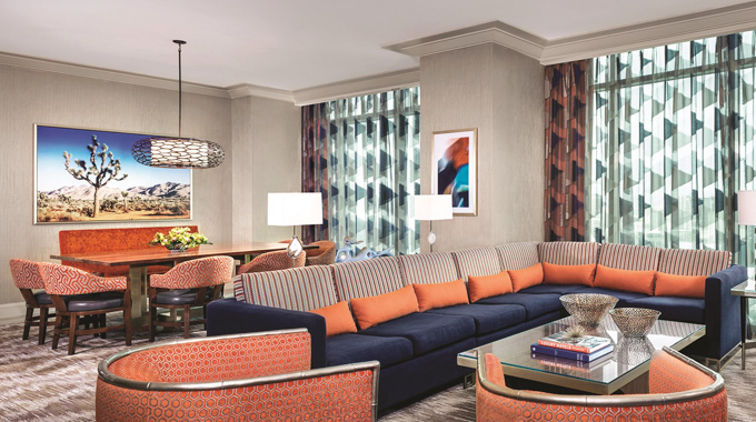 A combined living area and dining space inside a suite