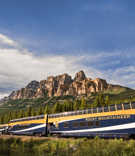 Castle Mountain looming above as Rocky Mountaineer passes