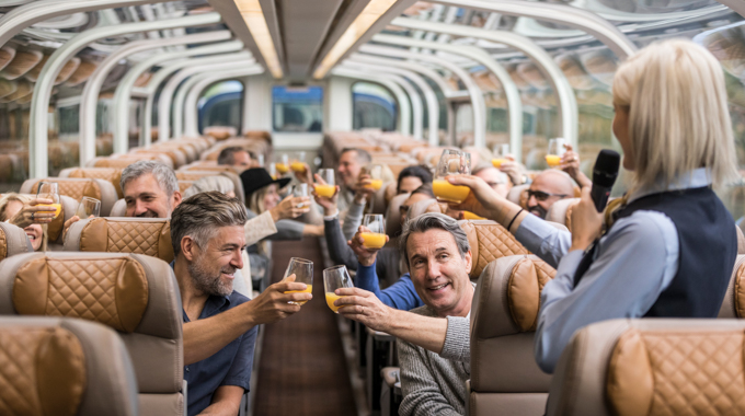 Guests raise their glasses for a toast aboard the Rocky Mountaineer