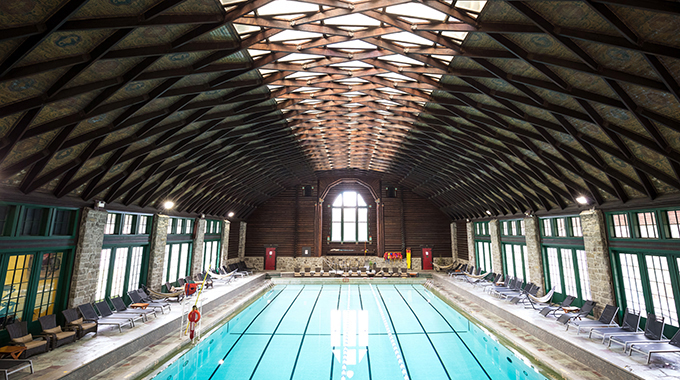 The lattice roof over the pool lets natural light inside. | Photo by One Tree Studio