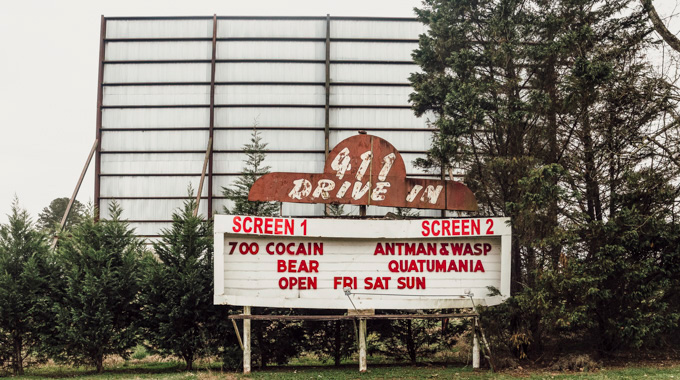 Drive-in marquee with movie titles