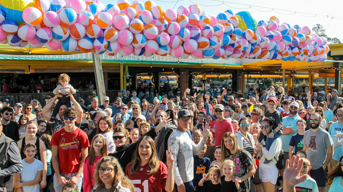 Beach balls hovering over the waiting crowd at LuLu's New Year's Eve celebration.