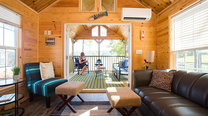 Eagle’s Landing offers tiny house–style cabins with modern conveniences, such as air-conditioning, Wi-Fi, and 120-square-foot screened-in porches.