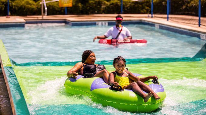 Woman and young girl on an inner tube