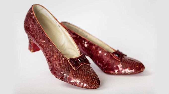 On display is one of the original pairs of ruby slippers from “The Wizard of Oz” (1939). | Photo by Josh White; JWPictures/Academy Museum Foundation