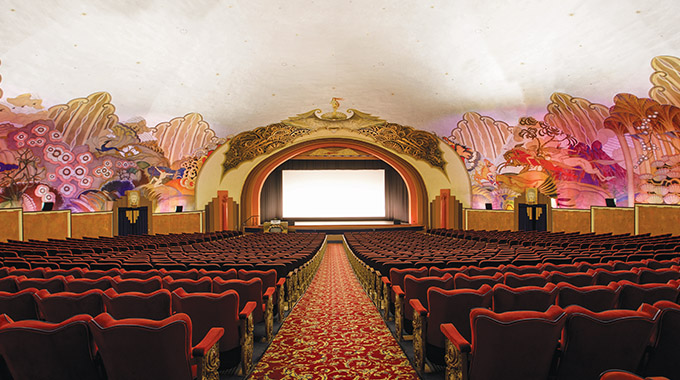 Murals frame the walls inside the Casino movie theater