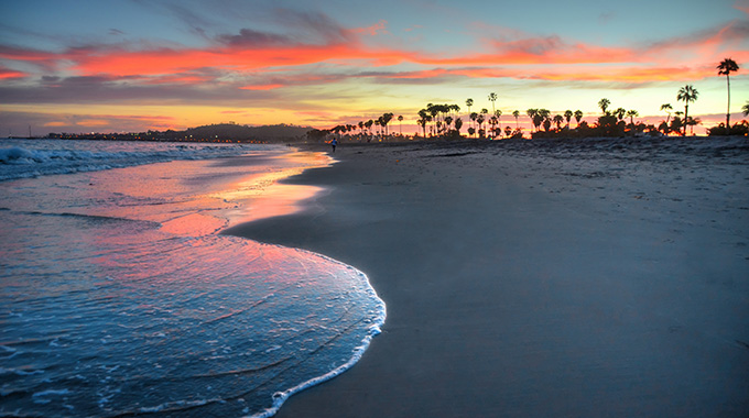 The sun sets over East Beach in Santa Barbara, California