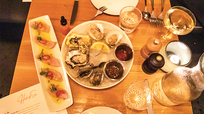 Servings of oysters and yellowtail