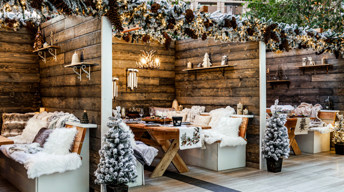 Booths at The Bar at Fairmont Century Plaza dressed with winter decor.