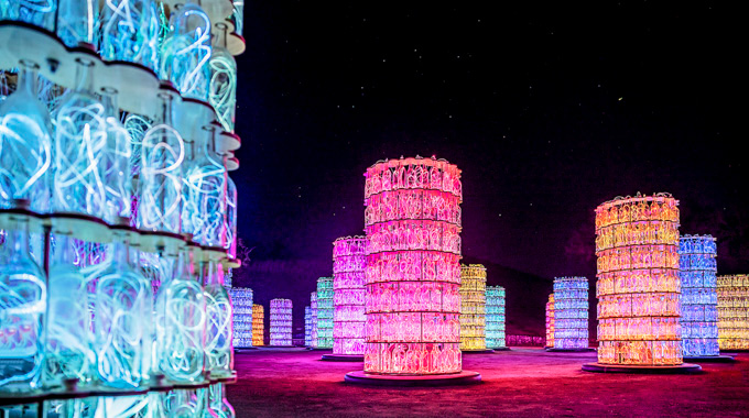 Bottles filled with light strings make up the illuminated Sensorio Light Towers