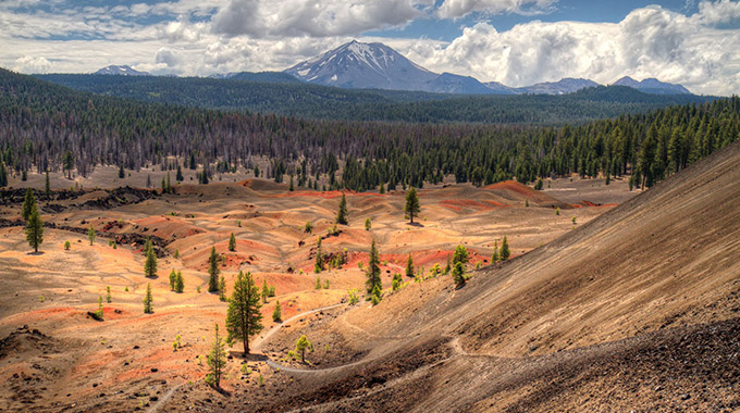 I was hiking down on the other side of Cinder cone when i came upon this view of the Painted Dunes with mount Lassen in the distance in Lassen Volcanic National Park, California, USA.