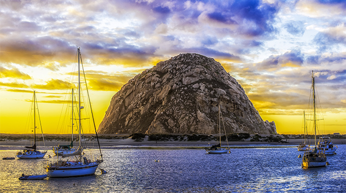 Morro Rock, a California Historical Landmark, stands watch over Morro Bay Harbor. 