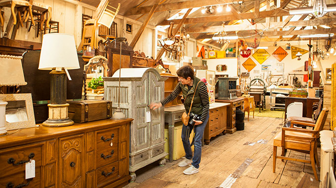 A shopper inspecting a piece of furniture