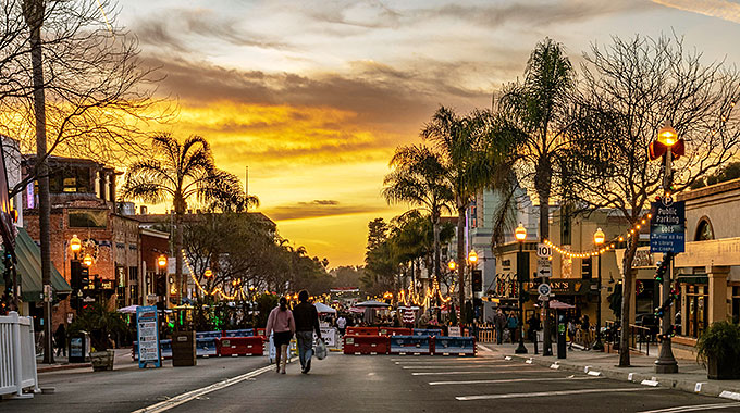 People walking at an outside market in downtown Ventura.