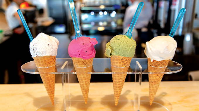 Four cones, each with a scoop of gelato