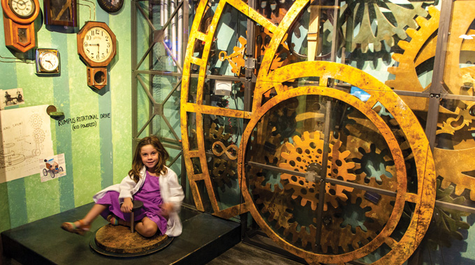 A young girl playing in Pennypickle's Workshop