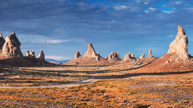 Trona Pinncacles tufa spires casting looming shadows across Death Valley