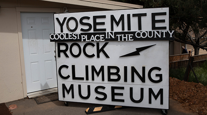 A sign proclaims the Yosemite Rock Climbing Museum as the "coolest place in the county"