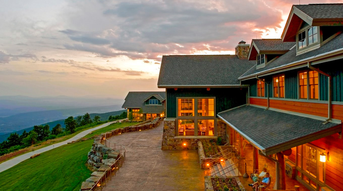 Guests enjoying the view of the Petit Jean River Valley from the back porch of the Lodge at Mount Magazine