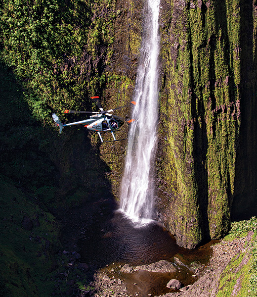 A Paradise Helicopters tour of the Kohala region takes guests up close to towering waterfalls. 