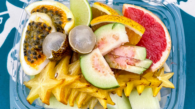 Assortment of fresh lychee, passion fruit, guava, and other fruit