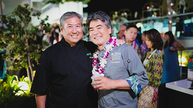Hawai‘i Food and Wine Festival co-chairpersons (from left) Alan Wong and Roy Yamaguchi at the 2019 event. | Photo courtesy Hawai‘i Food and Wine Festival/Kris Labang 