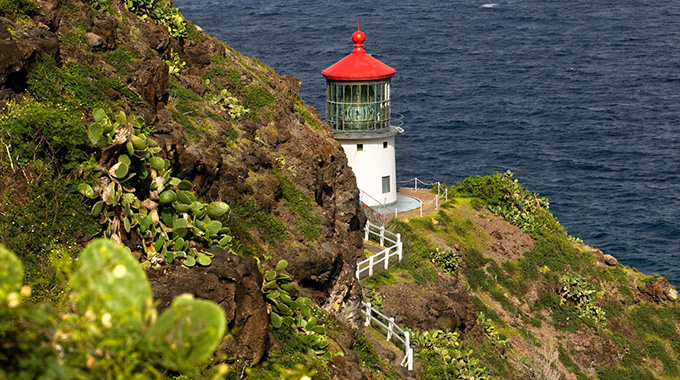 The Makapu’u Point Lighthouse, while not open to the public, is a picturesque beacon for hikers. | Photo by Sergi Reboredo/Alamy Stock Photo