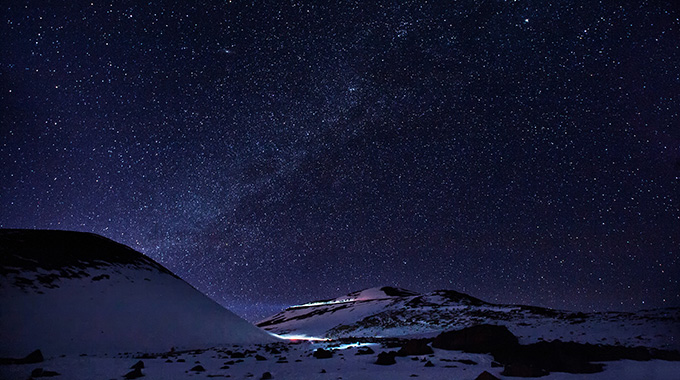 Stars shimmering in the dark sky above Mauna Kea.