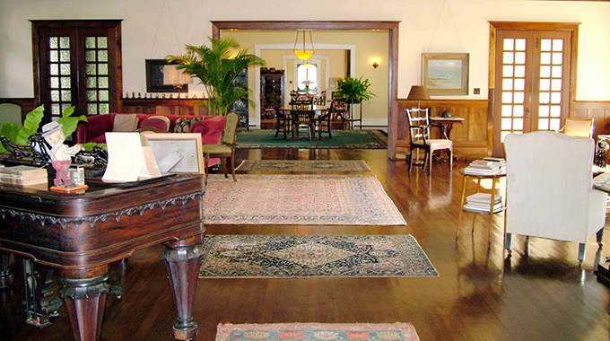 The historic main house at Grove Farm Museum on Kaua‘i contains an 1861 Chickering grand piano and other elegant furnishings.