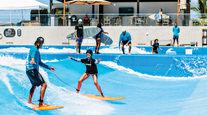 Author Mindy Pennybacker balances at the wave pool.