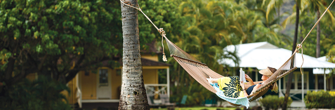 Stress melts away during a stay at Waimea Plantation Cottages, with its expansive lawns, ideal for games such as boccie, and tropical blooms.
