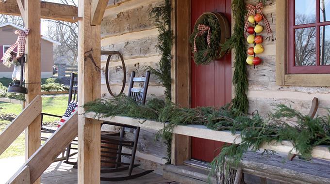 Visitors to Ste. Geneviève will find historic buildings and cabins, like the Sassafras Creek Cabin, decorated for the holidays. | Photo courtesy R. Mueller