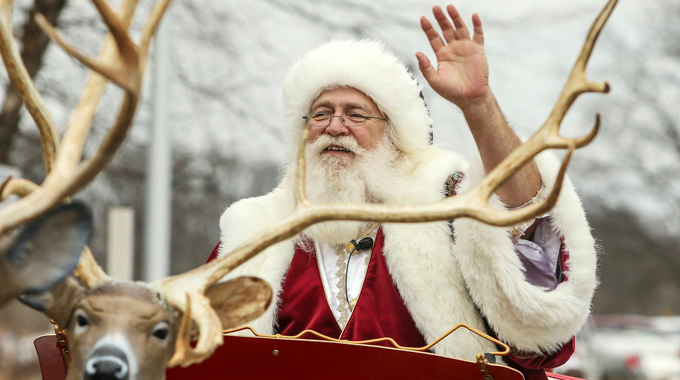 Santa waving during the Santa Claus Christmas Parade
