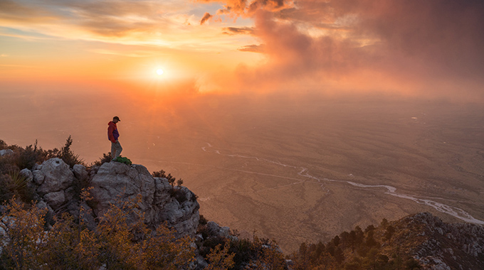 Texas, Guadalupe Mountains National Park, Hunter Peak summit view, Bowl Trail, sunrise with fog, hiker John Morlock